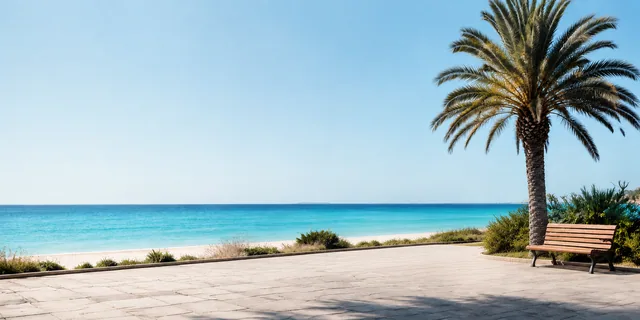 Beach promenade with a bench, palms and turquoise Mediterranean water
